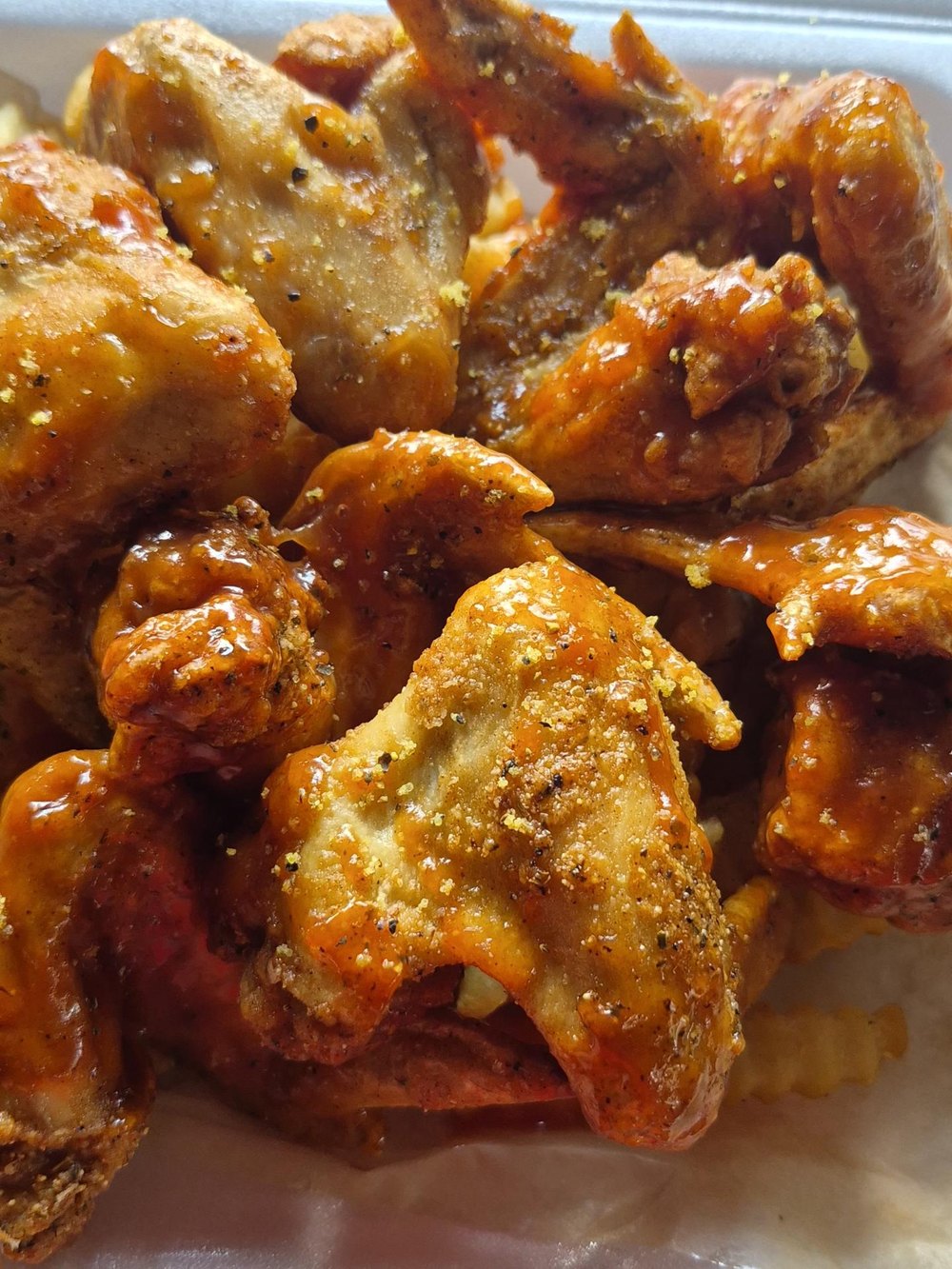 A pile of Chi Spot whole wings, cooked to order for an event